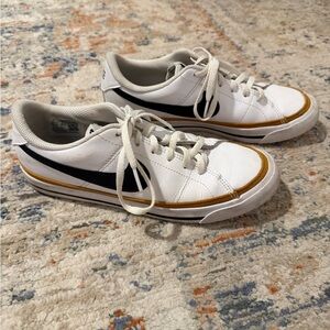 Nike White and Black Womens Sneakers with Gold Accents